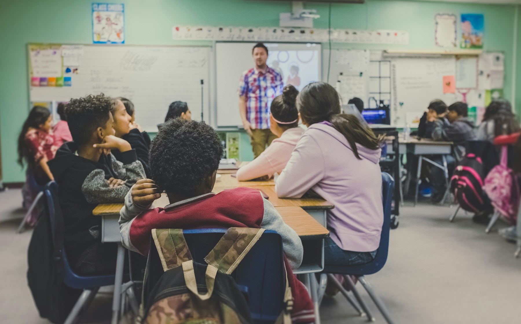Students learning together in a bright classroom